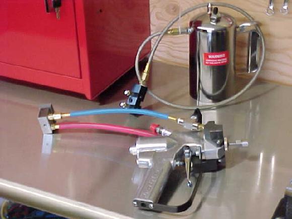 Solvent pot and spray gun with AB Block Assembly.